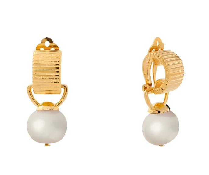 Get that quirky and playful look with the Pearl Scalloped Clip Earring by CC and Co by Catherine Camino! Featuring a striped texture clip and a detachable baby pebble pearl charm, this earring will make you stand out. The 13x16 mm size and surgical steel paddle backing ensures a comfortable fit, while the overall length of 5/8" adds a touch of elegance. Finished with a polished 14 karat gold over brass, you'll love the fun and stylish vibe of these earrings!