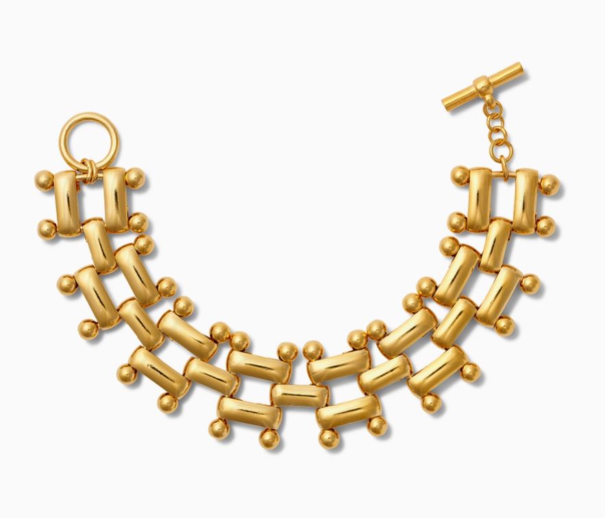 Get ready to add some flair to your wrist with this Epaulette Link Toggle Bracelet! The fluid links are polished with 14-karat gold over brass, giving off a touch of elegance. This bracelet is 3/4" wide and measures 7 1/2" end to end. The signature toggle and ring clasp by CC & Co by Catherine Canino give it a unique touch. So go ahead, rock this quirky and fun bracelet with confidence!