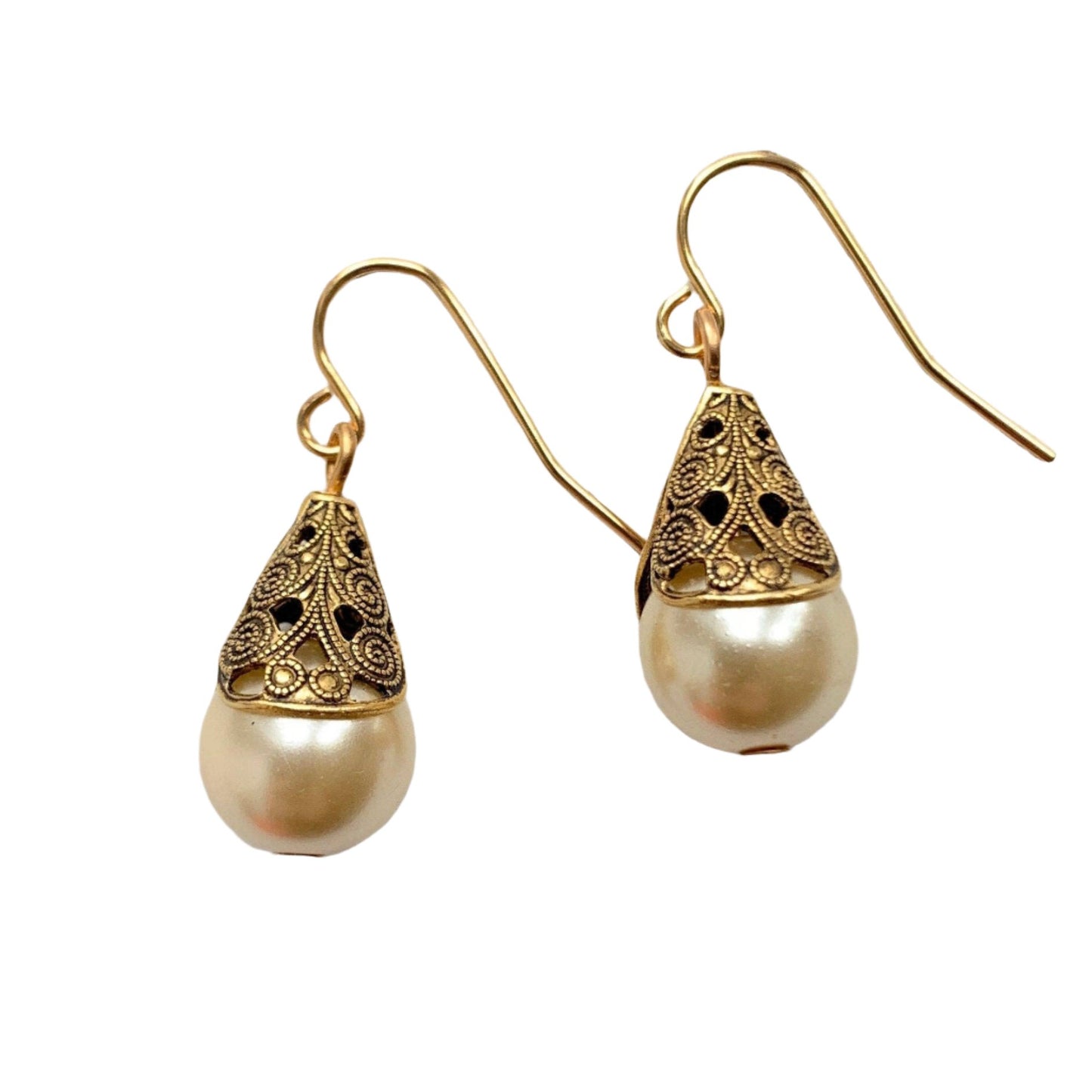 This is a classic minimalist earring style that never leaves the Lenora Dame collection. Sophisticated pearls cupped into high-quality gold plated brass filigree bead caps with detailed scrolled etching give these earrings a high-end vintage inspired earring look. These earrings have a dainty total drop length of 1-inch. Perfect gift or treat yourself to this earring that's perfect to add a little bling and sparkle to casual or special occasion outfits. Make it a set with the Filigree Bead Cap Necklace.