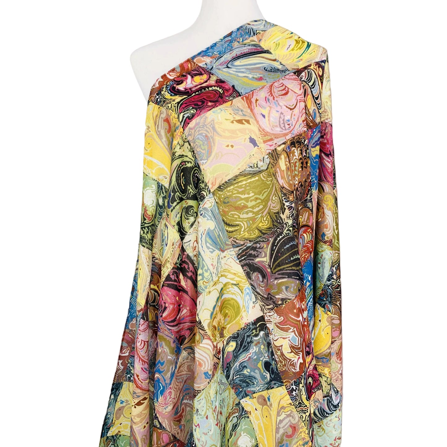 Colorful floral patterned fabric on a mannequin against a plain background