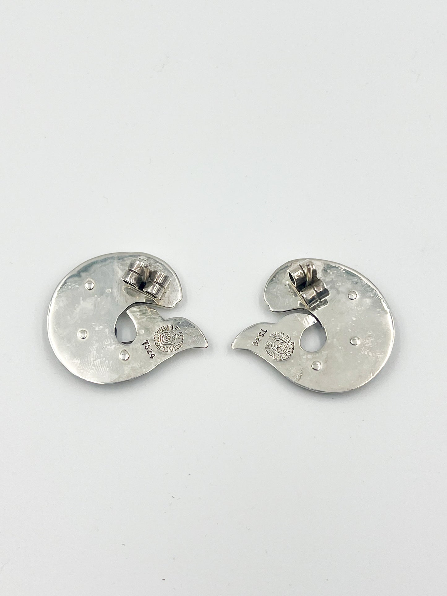 These fun and quirky Sterling Silver and Ebony Fish Post Earrings feature a durable black/brown hardwood known for its sleek look. The color combination of silver and ebony adds an elegant touch. All pieces created after 1979 by the Sucesores de William Spratling bear the Mexican registry mark TS-24 and a replica of an older Spratling hallmark.