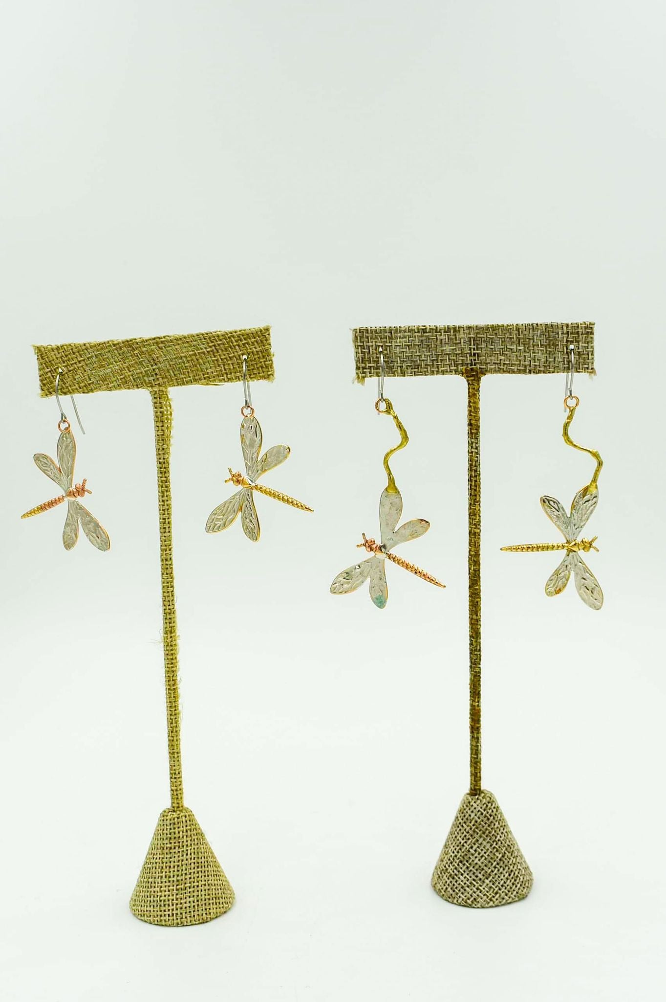 Made with enameled: Brass, bronze, and copper with silver Locally made in Louisiana. Designs are larger and large drop earrings.