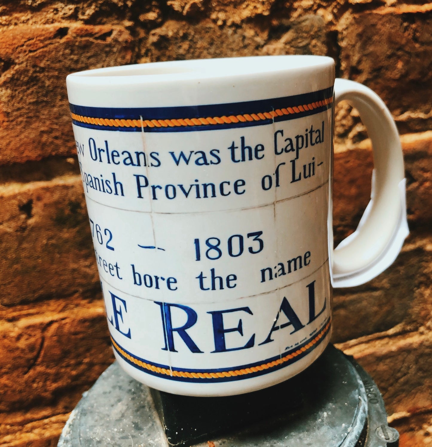 Replicas of the Spanish colonial street names found around the French Quarter. 11 oz mugs Microwave and dishwasher safe  Locally made in Louisiana  Available names: Orleans, Bourbon, Plaza D' Armas, Real (Royal), Del Main (Dumaine) and San Luis (St. Louis) 
