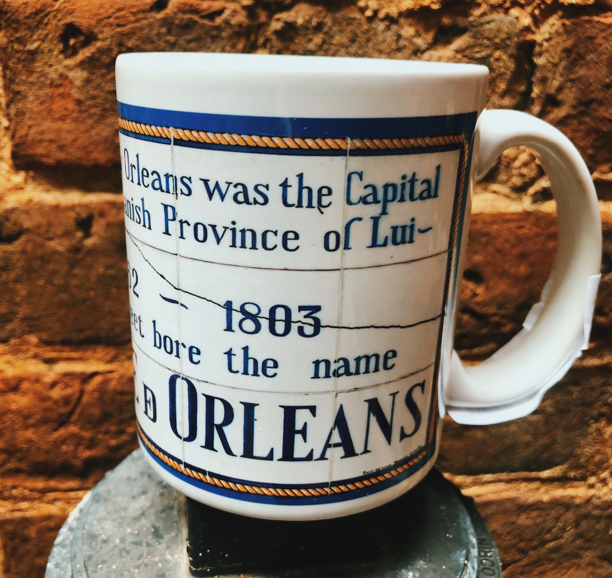 Replicas of the Spanish colonial street names found around the French Quarter. 11 oz mugs Microwave and dishwasher safe  Locally made in Louisiana  Available names: Orleans, Bourbon, Plaza D' Armas, Real (Royal), Del Main (Dumaine) and San Luis (St. Louis) 