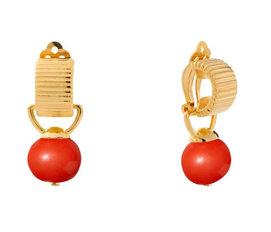 Introducing CC and Co's Salmon Scalloped Pearl Clip Earring, crafted by the talented Catherine Camino. This fun find has a stripey texture and a charming baby pebble that can be detached, and is held in place with a surgical steel paddle backing. With an overall length of 5/8'' and a polished 14 karat gold over brass finish, this piece is sure to add some playfulness to your look