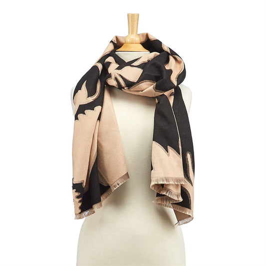 The versatile design of this shawl allows for endless styling possibilities. Drape it over your shoulders for a chic and effortless look or wrap it around your neck as a statement scarf. The abstract botanical print is both trendy and timeless, making it a great accessory to wear all year round.  Super soft viscose-polyester blend 70"L Reversible wear