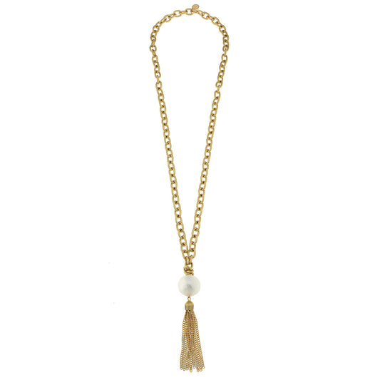 Susan Shaw's 32" Gold Chain with White Cotton Pearl and Tassel is the perfect quirky addition to any jewelry collection.