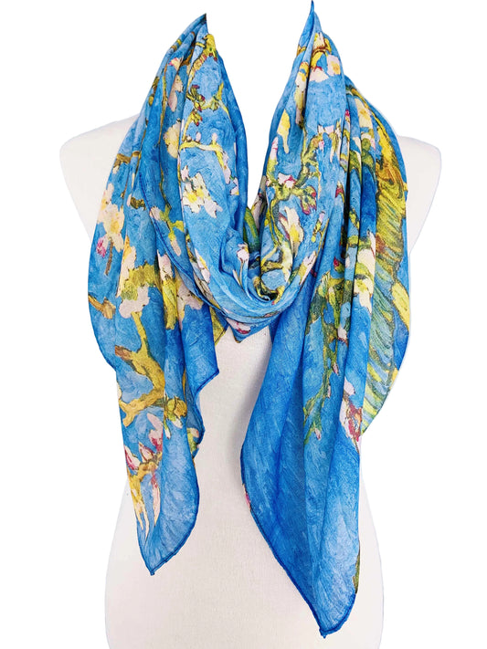 Blue scarf with floral pattern on a mannequin against a light blue background