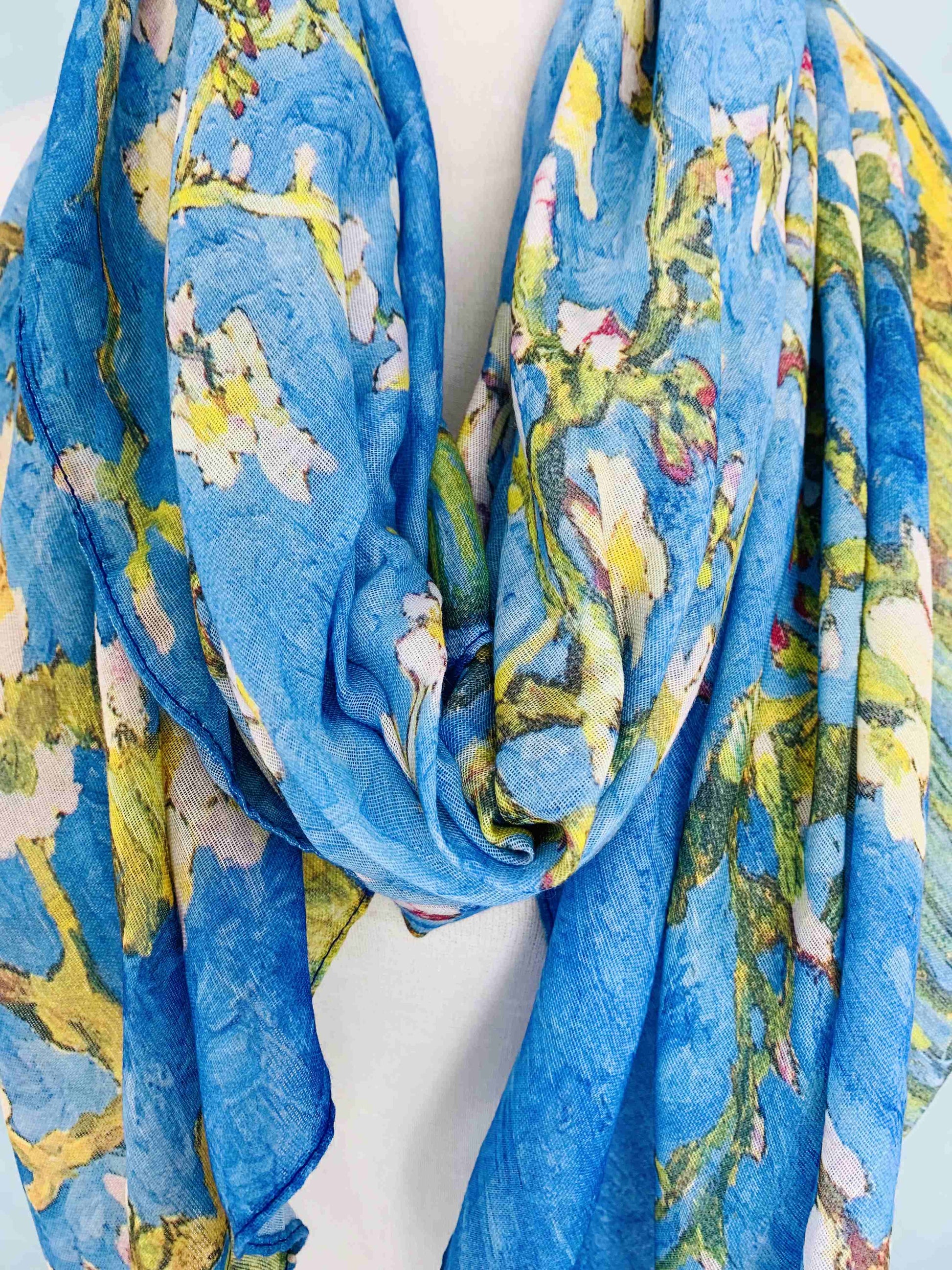 Blue floral patterned scarf on a white background