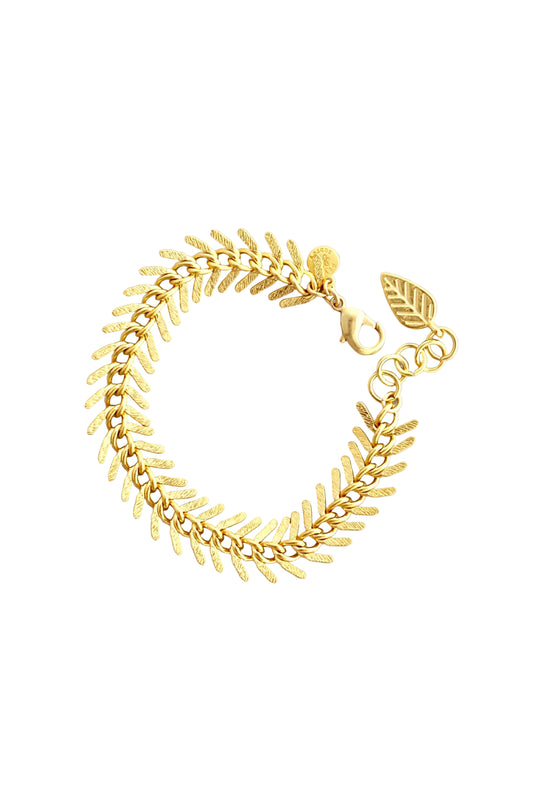 Gold leaf bracelet on a light gray background