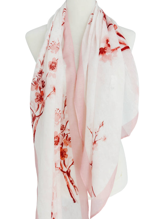 Floral patterned scarf on a mannequin with a white background