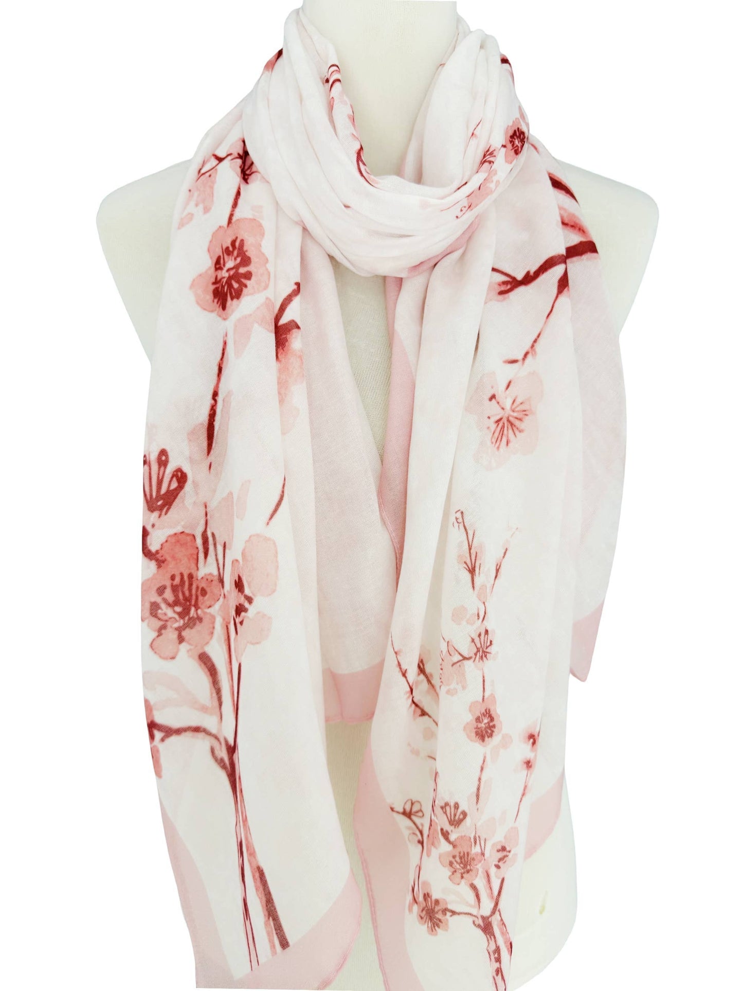 Floral patterned scarf on a mannequin with a white background