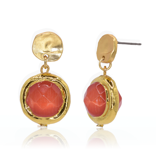 Add a pop of playful color to your look with our Coriandoli Earrings in Coral! These earrings feature faceted beads on a simple stud, crafted from a base of pewter alloy plated in 24-kt gold or sterling silver. Measuring 1" long, they're sure to make a statement. Complete with a post back closure.