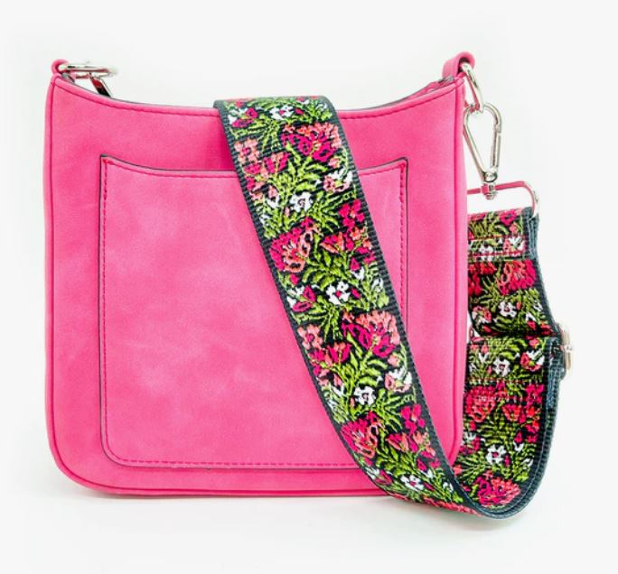 Ashley Suede Crossbody Bag Fuschia/Pink The Ashley Crossbody Bag is a stunner - with lux vegan suede in popping colors and two straps: one vibrant guitar and one faux suede to match. Not to mention the built-in RFID-protected card slots, this purse is the hottest way to keep your goodies safe and stylish. Plus, the open pocket on the front is perfect for easy access!