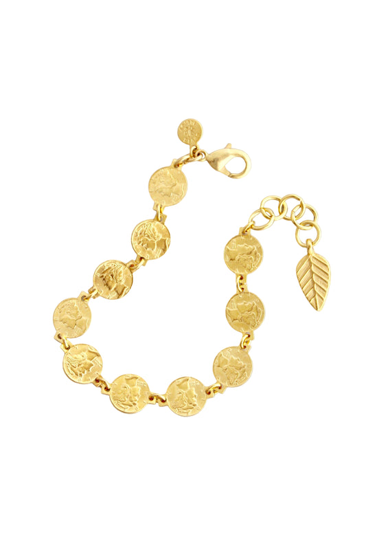 Gold bracelet with coin-shaped links on a light gray background
