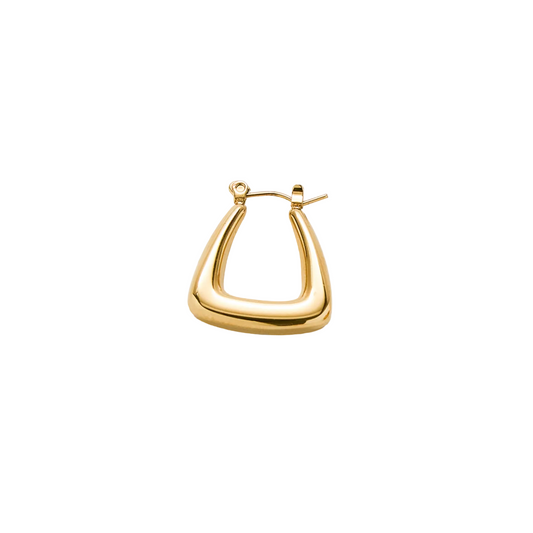 Gold hoop earring on a light gray background