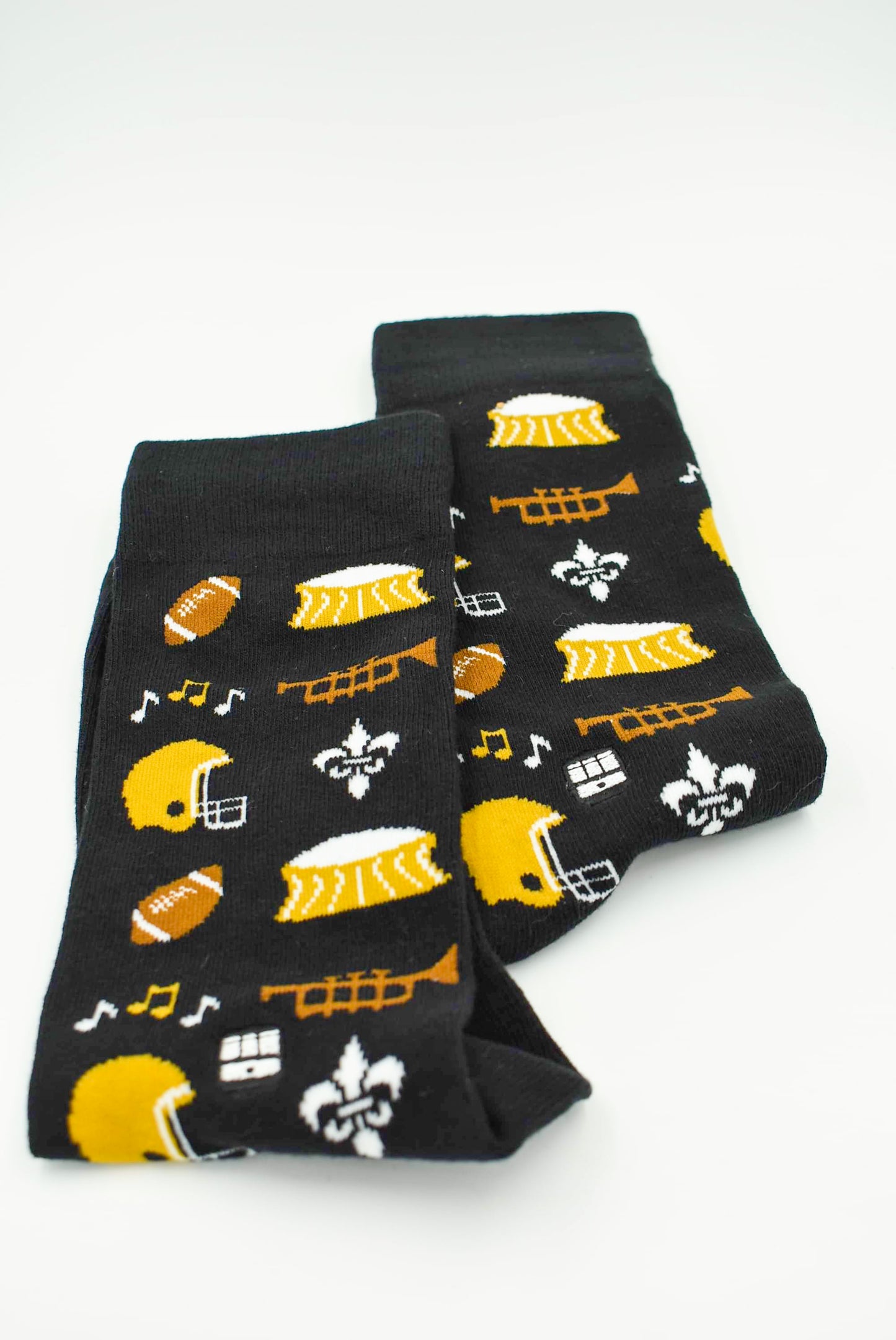 Black Unisex Socks with Trumpet, Music Symbols, Superdome, Footballs, and Fleur De Lis Designs. Made In New Orleans