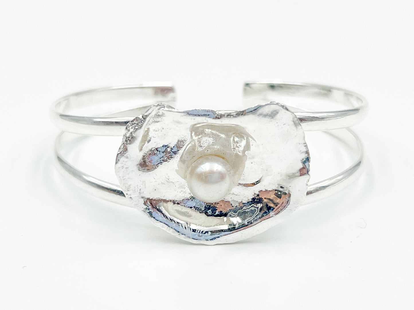 silver plated oyster bracelet on white background