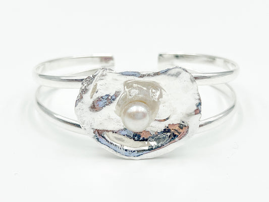 silver plated oyster bracelet on white background