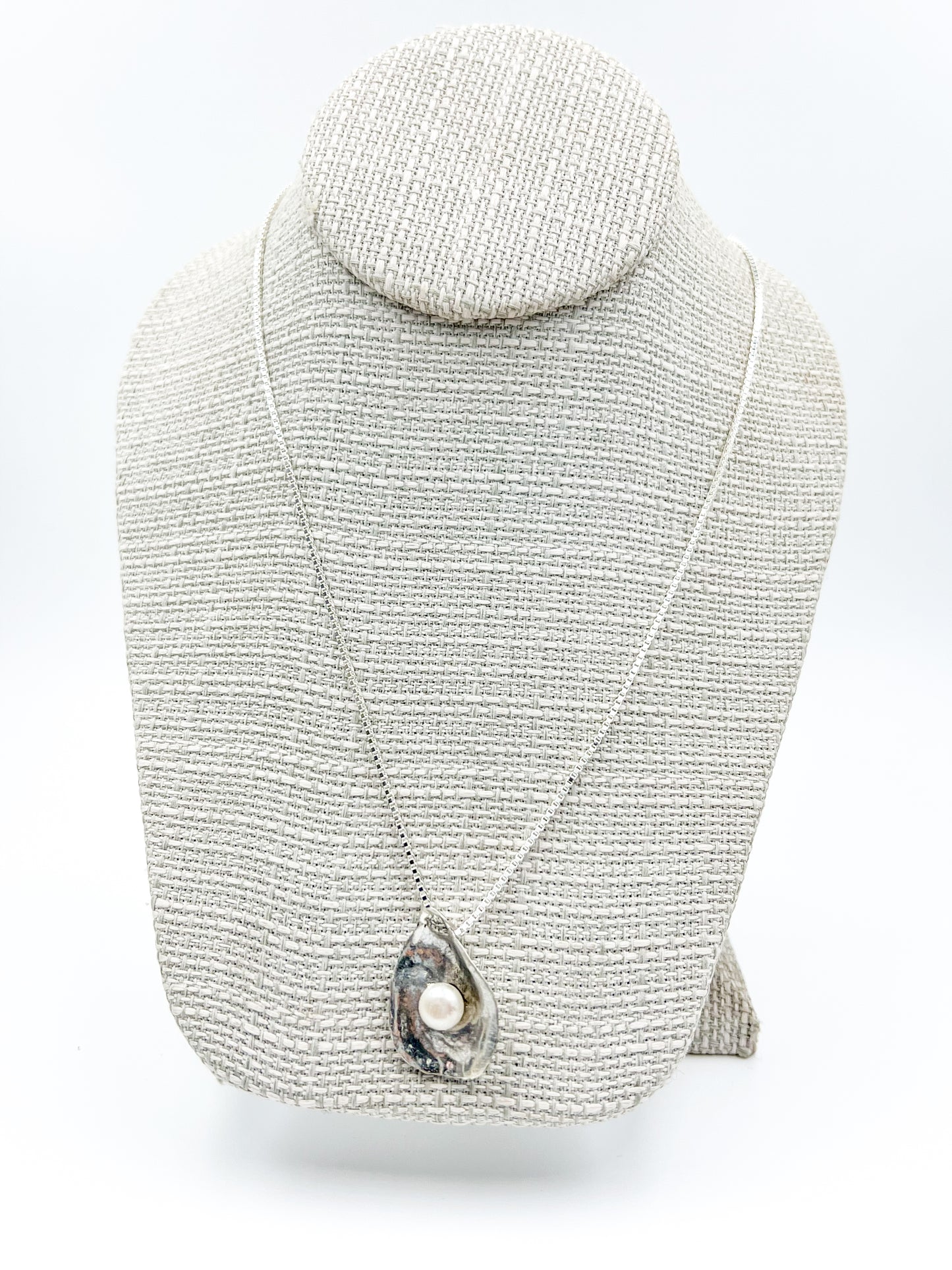 Dive into Lety G's beloved oyster collection with this stunning necklace, showcasing her signature oyster pendant cradling a luminous freshwater pearl. The 20" sterling silver box chain offers the perfect length for everyday wear and layering. Mix and match with the viral TikTok oyster bracelet and petite earrings to craft your own pearl-inspired jewelry story.