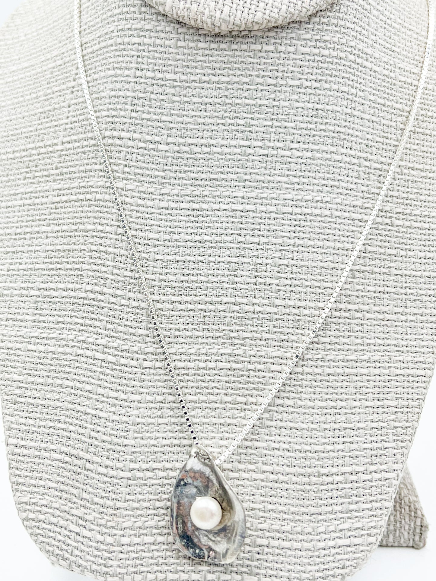 Dive into Lety G's beloved oyster collection with this stunning necklace, showcasing her signature oyster pendant cradling a luminous freshwater pearl. The 20" sterling silver box chain offers the perfect length for everyday wear and layering. Mix and match with the viral TikTok oyster bracelet and petite earrings to craft your own pearl-inspired jewelry story.