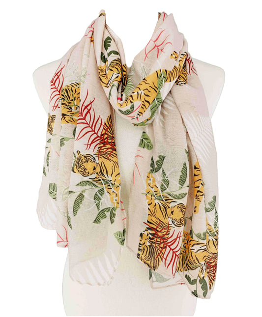Scarf with tiger and leaf pattern on a mannequin against a beige background