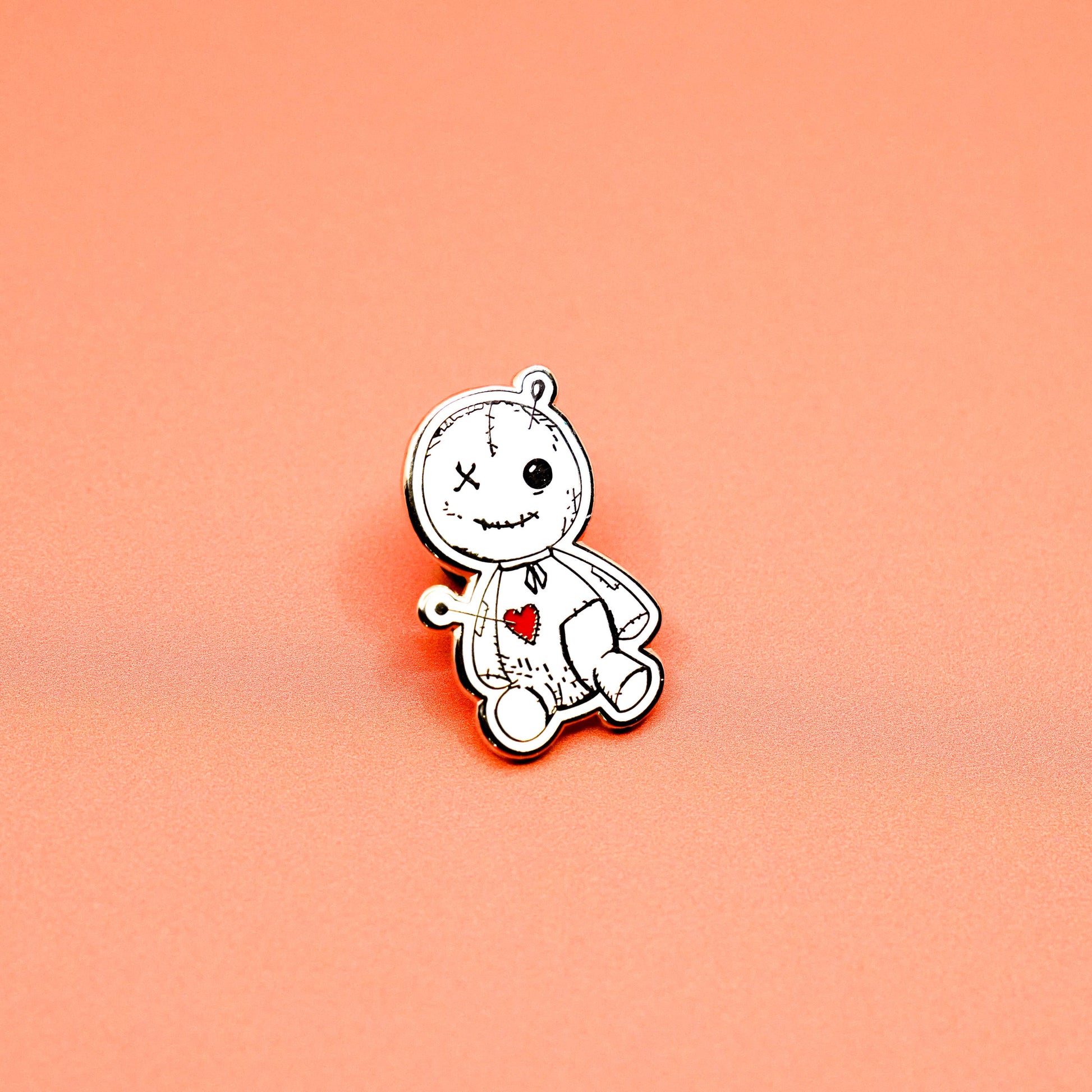 Summon some magic with our Voodoo Doll enamel pin! This gold plated pin features a cute and quirky original illustration, measuring 1-1/4" x 3/4". Created by local artist Statement Goods, this pin comes with a secure Black Rub for added style.