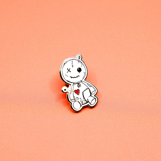 Summon some magic with our Voodoo Doll enamel pin! This gold plated pin features a cute and quirky original illustration, measuring 1-1/4" x 3/4". Created by local artist Statement Goods, this pin comes with a secure Black Rub for added style.