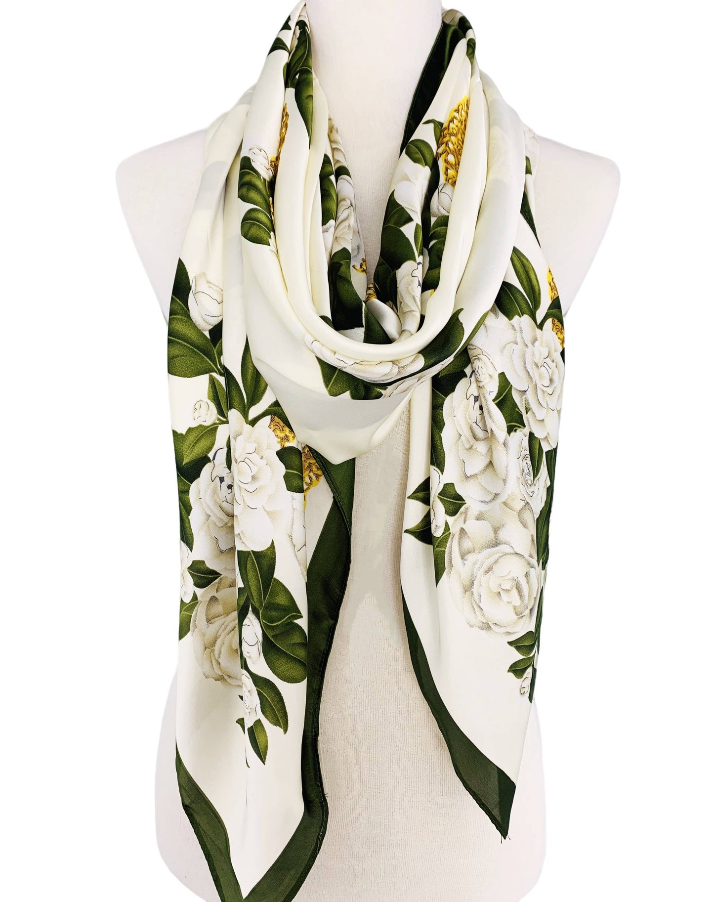 Floral patterned scarf on a mannequin with a white background