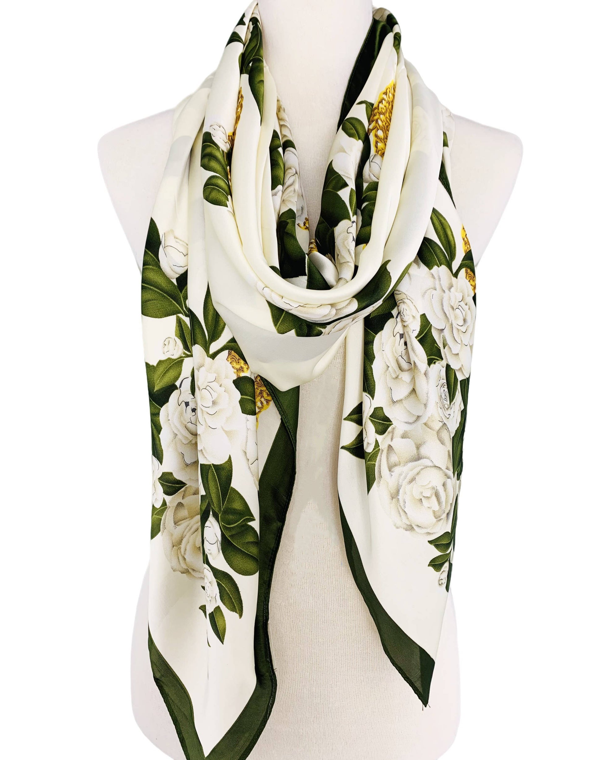 Floral patterned scarf on a mannequin with a white background