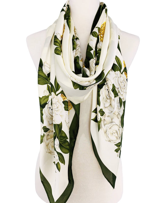 Floral patterned scarf on a mannequin with a white background