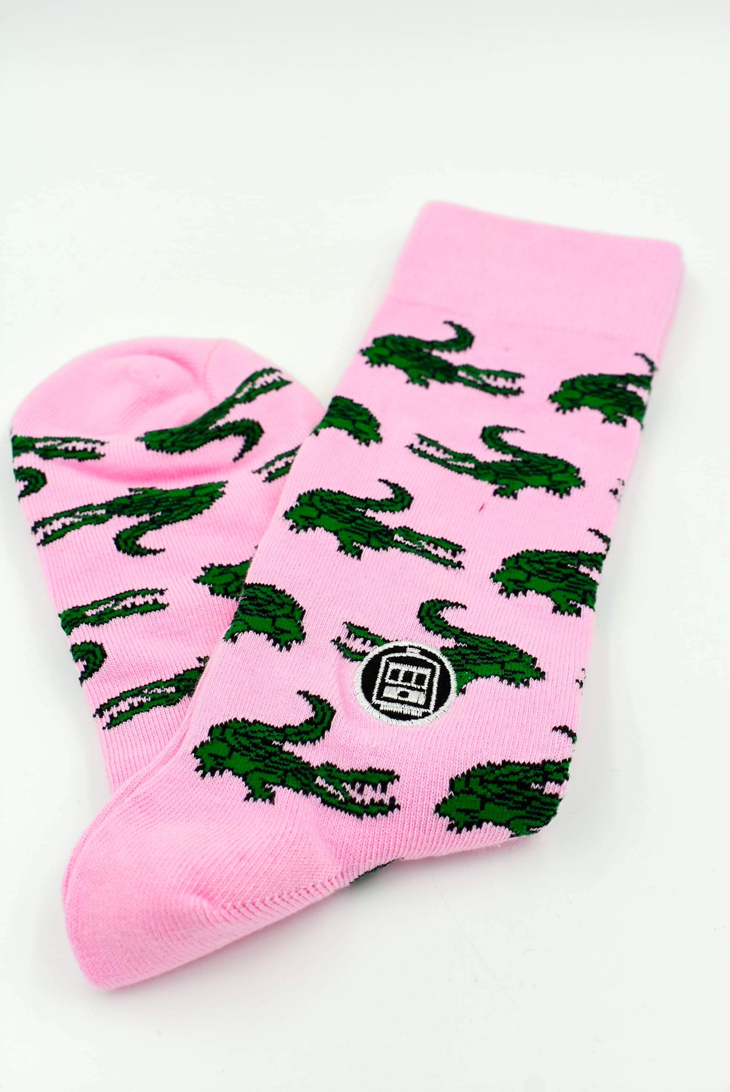 Calcetín de cocodrilo rosa