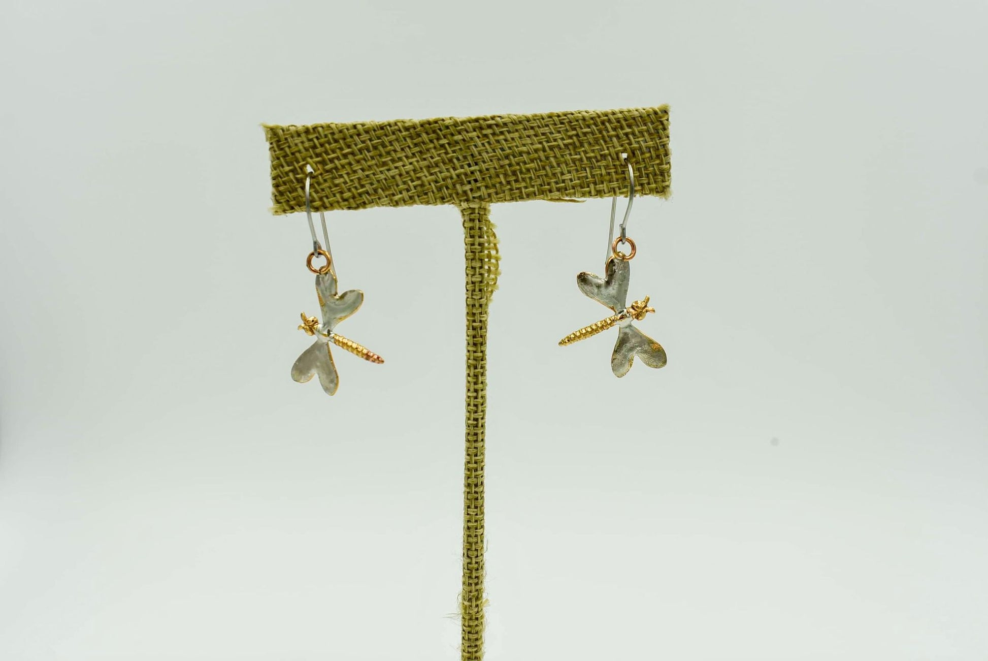 Small Dragonfly Earrings that measure 2" down. Made from brass bronze and copper with sterling silver wire back