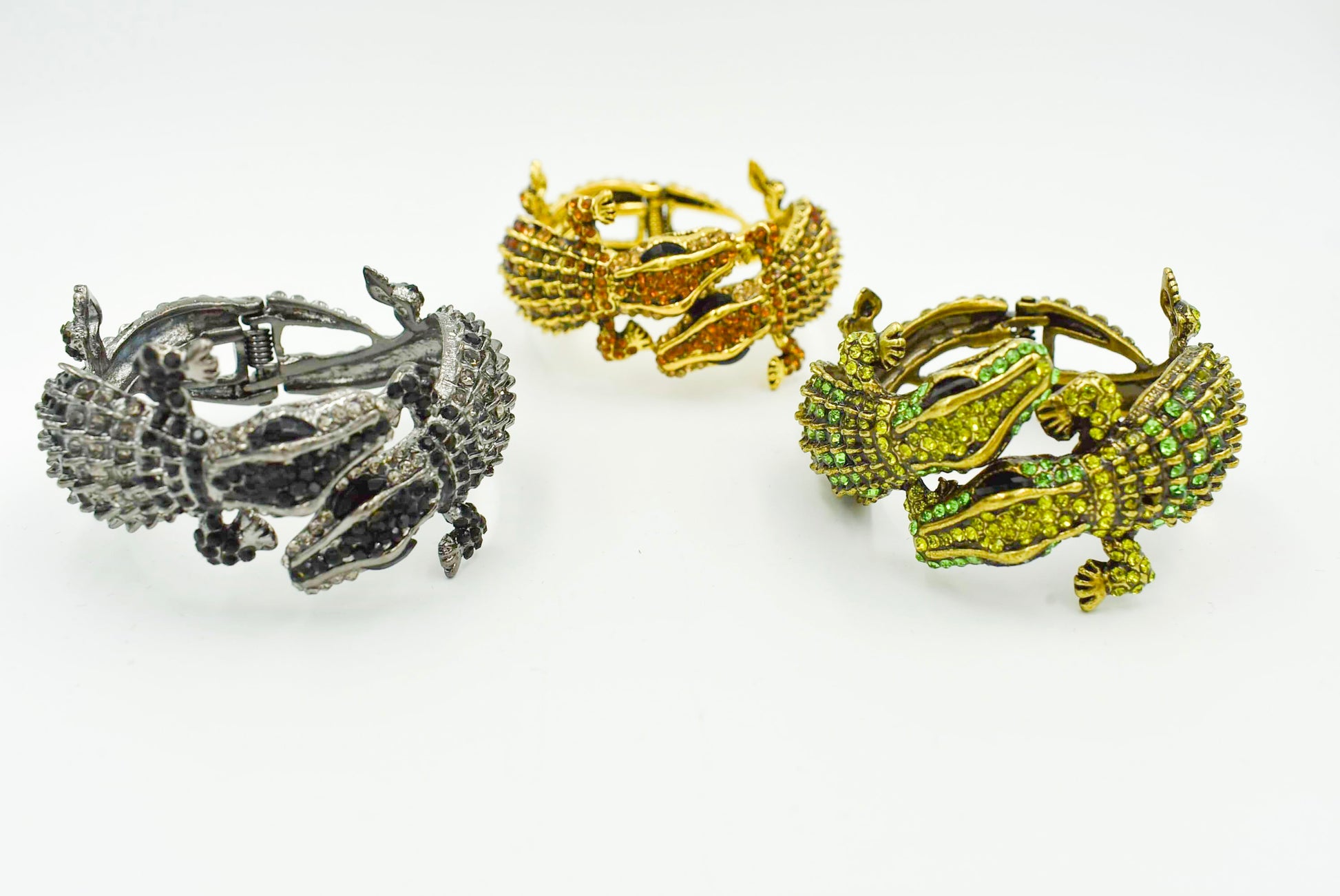 Double Alligator Bracelet. Jeweled Alligator hingle bracelets. Fits most smaller to medium wrists. Black, Green, and Amber colors