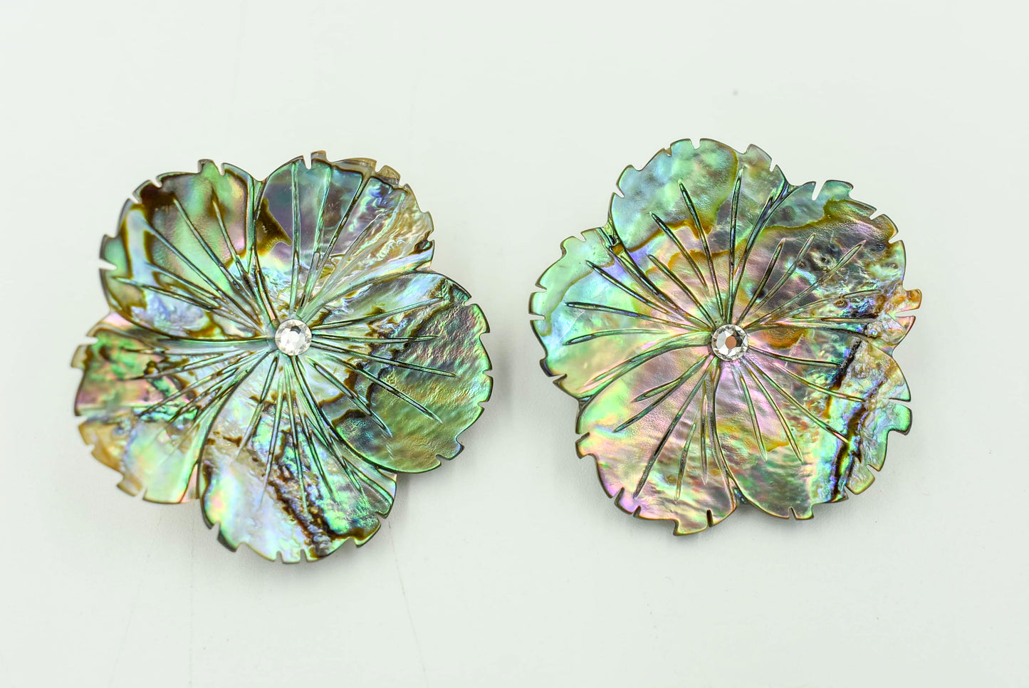 Clip Earrings in the shape of flowers. Abalone Color with Jewel in the Middle. 