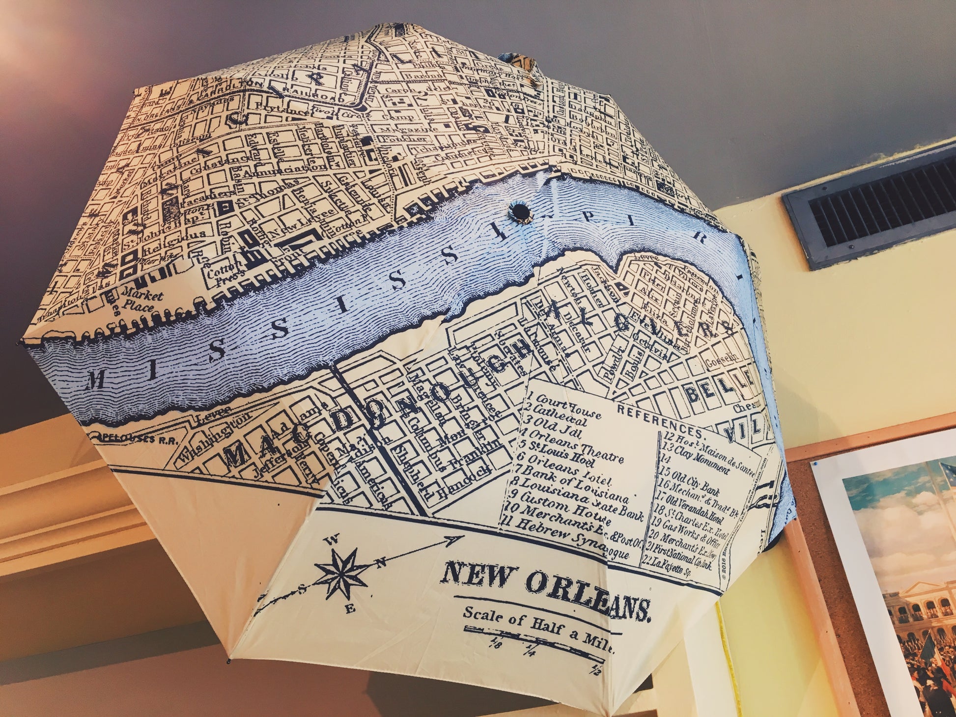 Beautiful umbrella with a great vintage map of downtown New Orleans featuring the meandering Mississippi River tinted in a fictitious light clear blue. You'll never get lost in the French Quarter again.... well if you were in the 1890s this map would work, but really not much has changed down here. It will also keep you just as dry as your standard 42" diameter auto open/close with fabric slip case umbrella. Collapses down to 11 inches long.